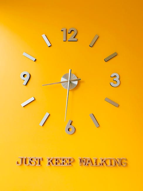 Wall clock with 'Just Keep Walking' text representing long term perspective